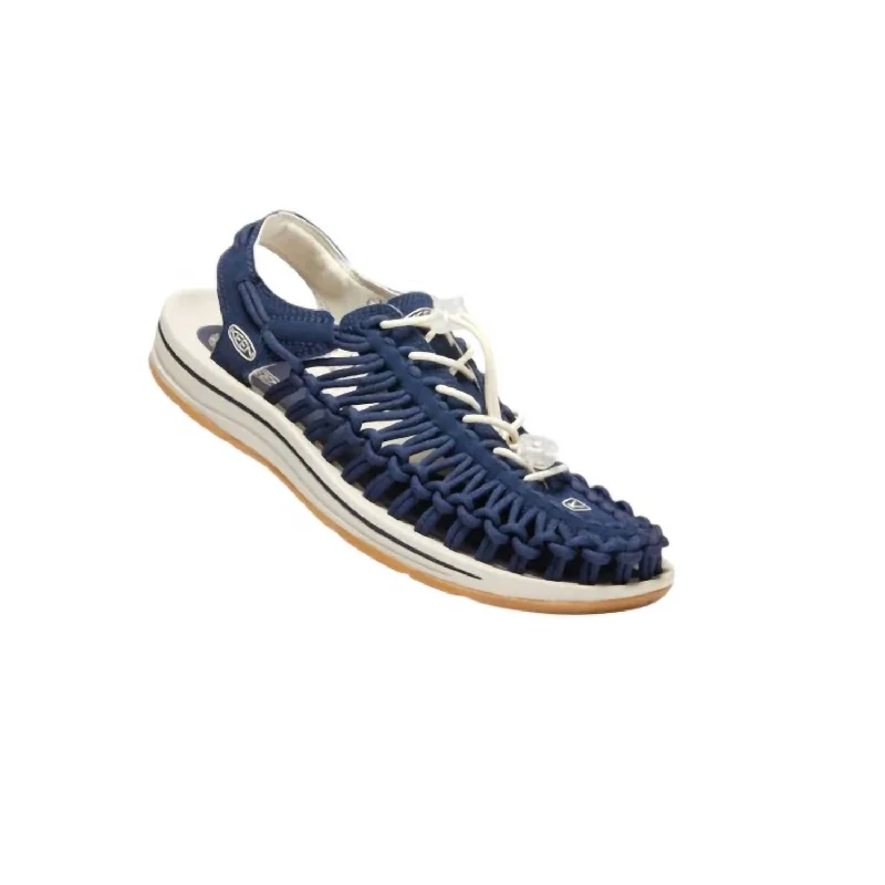 Men's sandals with a perforated leather upper for ventilationMen’S Uneek Sandals In Navy/birch Canvas