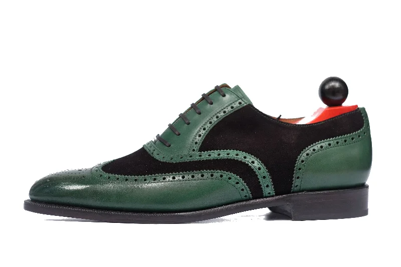Men's Oxford shoes with a wingtip design and leather soleKitsap - MTO - Forest Green Calf / Black Suede - TMG Last - Single Leather Sole - Heart Medallion Men's Oxford shoes with a wingtip design and leather soleKitsap - MTO - Forest Green Calf / Black Suede - TMG Last - Single Leather Sole - Heart Medallion