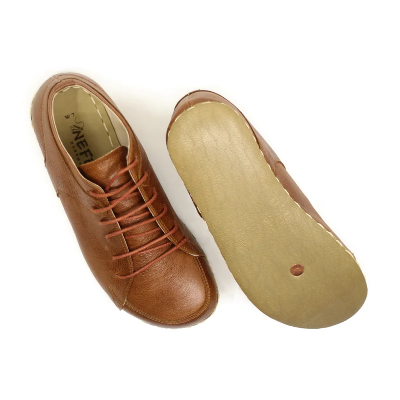 Men's barefoot shoes made of stretchy neoprene for a snug fitMen's Copper Rivet Earthing Leather Sneaker in Antique Brown Men's barefoot shoes made of stretchy neoprene for a snug fitMen's Copper Rivet Earthing Leather Sneaker in Antique Brown